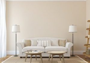 Modern,Living-room,Interior,With,White,Couch,Near,Empty,Beige,Wall.
